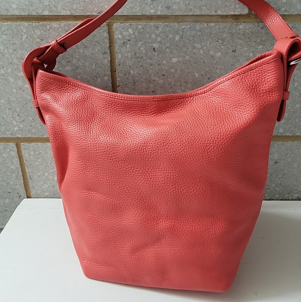 Coral leather shoulder bag by Coldwater Creek.